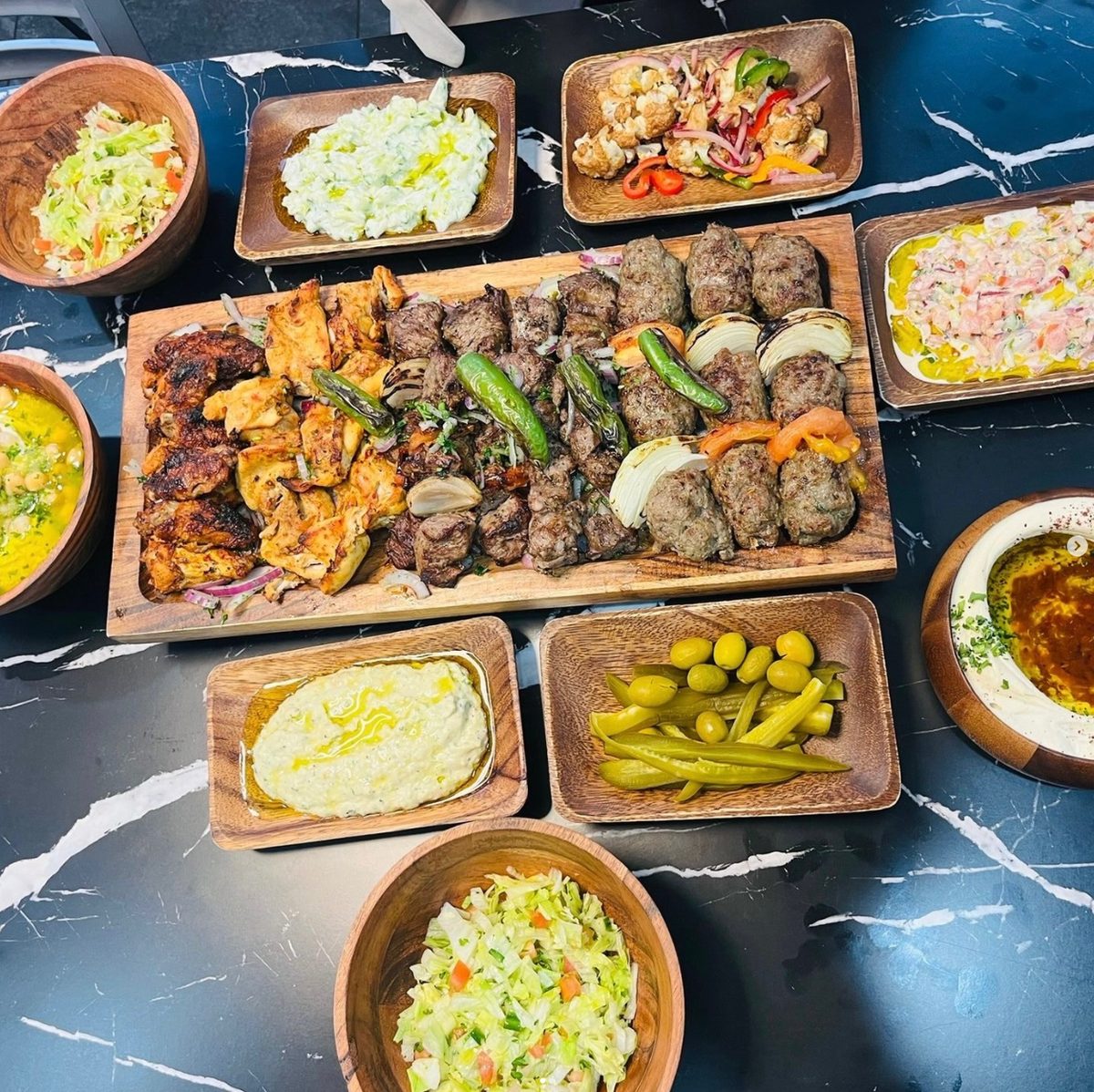 Mashawee Stop mixed grill platter with hummus, salads and sides